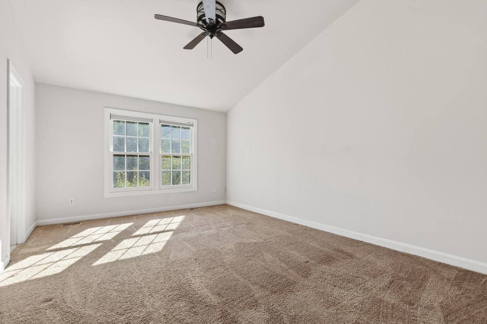 Primary bedroom in Woodbridge, VA, as photographed before staging